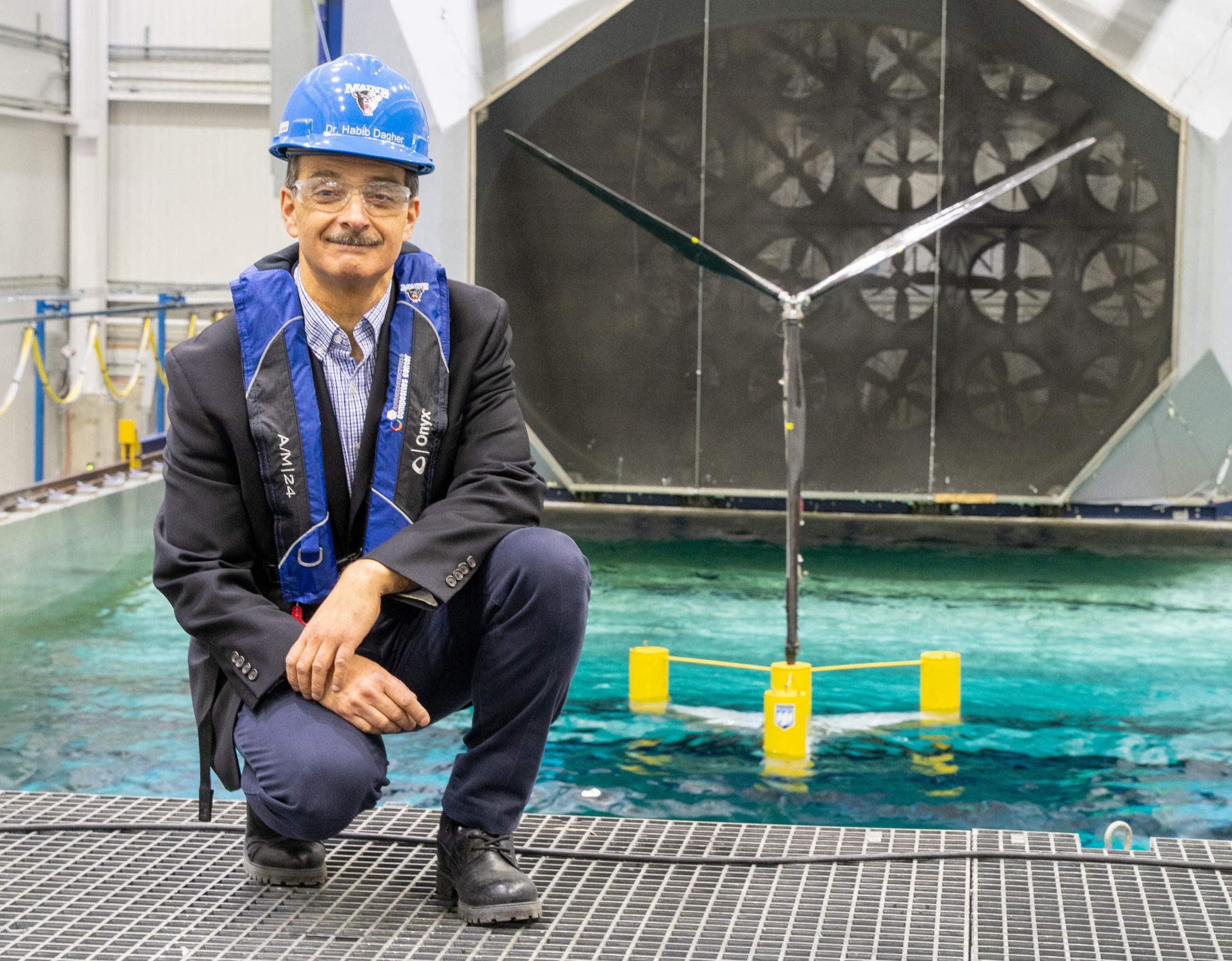 Maine Floating Offshore Wind Research Array: University of Maine's Habib Dagher with VolturnUS floating wind concept model during wave tank tests 